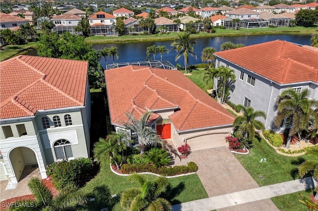 birds eye view of property with a residential view and a water view