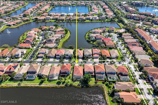 bird's eye view with a residential view and a water view