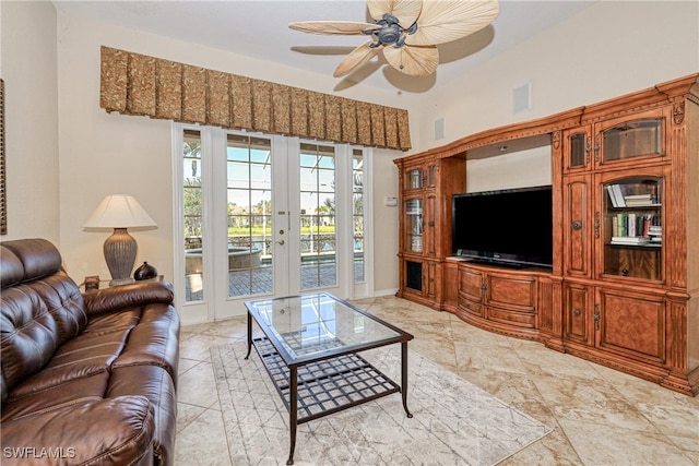 living room featuring visible vents, french doors, baseboards, and ceiling fan