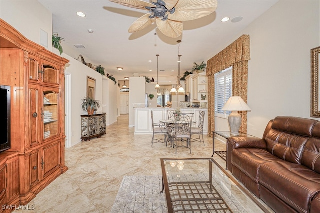 living area with recessed lighting, a ceiling fan, and visible vents