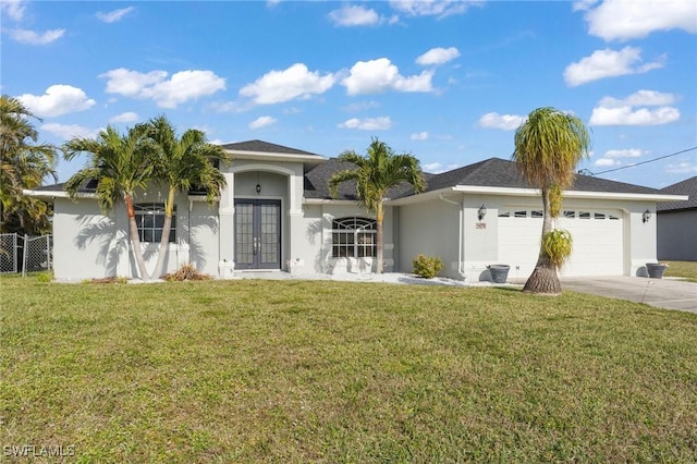 view of front facade with driveway, a garage, french doors, a front yard, and stucco siding