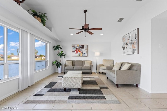 living room with light tile patterned floors, ceiling fan, lofted ceiling, recessed lighting, and visible vents