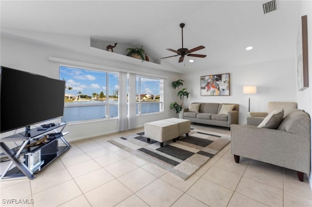 living area featuring recessed lighting, visible vents, vaulted ceiling, and light tile patterned floors