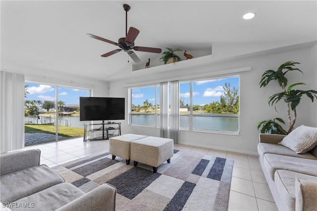 tiled living room featuring lofted ceiling, ceiling fan, recessed lighting, and baseboards