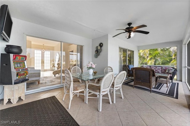 dining area with light tile patterned floors and ceiling fan