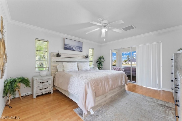 bedroom with access to outside, light wood finished floors, multiple windows, and visible vents