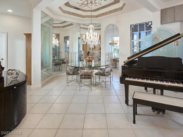 dining space featuring light tile patterned flooring, a notable chandelier, crown molding, a raised ceiling, and arched walkways