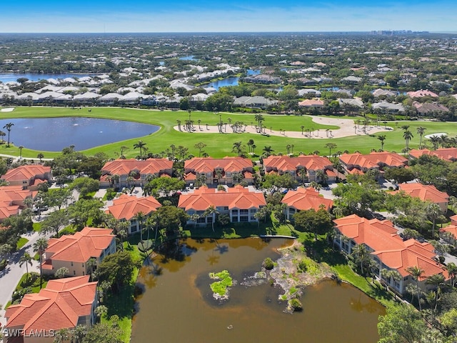 bird's eye view with view of golf course, a residential view, and a water view