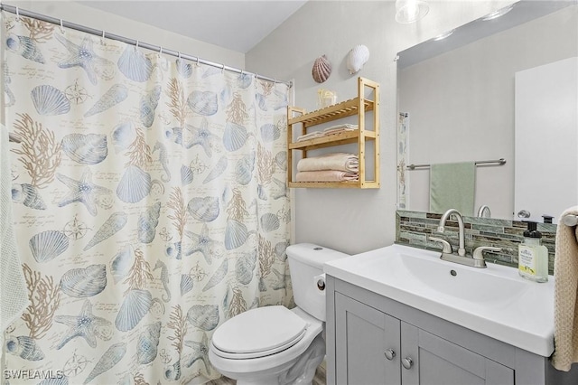 bathroom with toilet and vanity