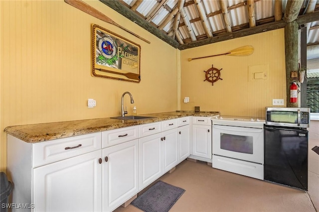 kitchen with stone countertops, a sink, white cabinetry, stainless steel microwave, and white range with electric stovetop