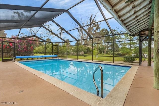 view of pool with a covered pool, a lanai, and a patio area