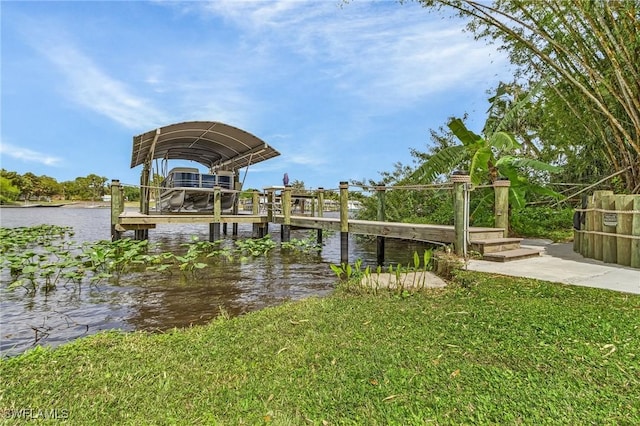 dock area featuring a yard and a water view