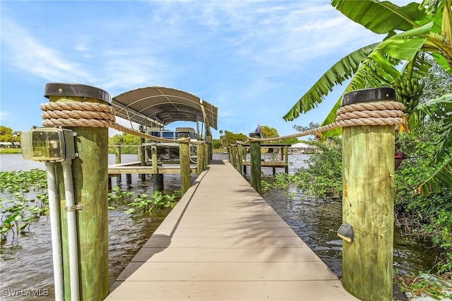 view of dock featuring a water view and boat lift