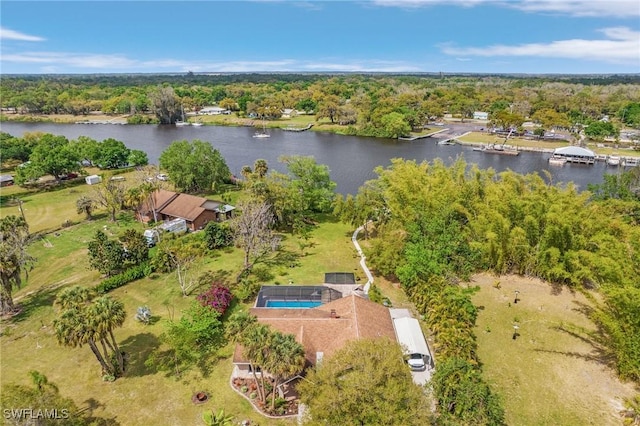 aerial view with a wooded view and a water view