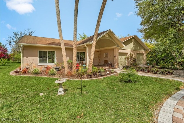 single story home with a garage, stucco siding, driveway, and a front lawn