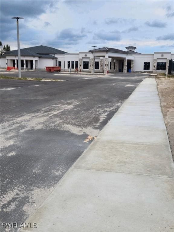 5910 Via Delray Blvd Unit B, Delray Beach, FL 33484 - view of building exterior with asphalt driveway