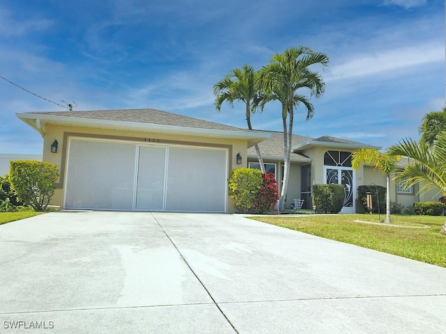 single story home with an attached garage, a front lawn, concrete driveway, and stucco siding