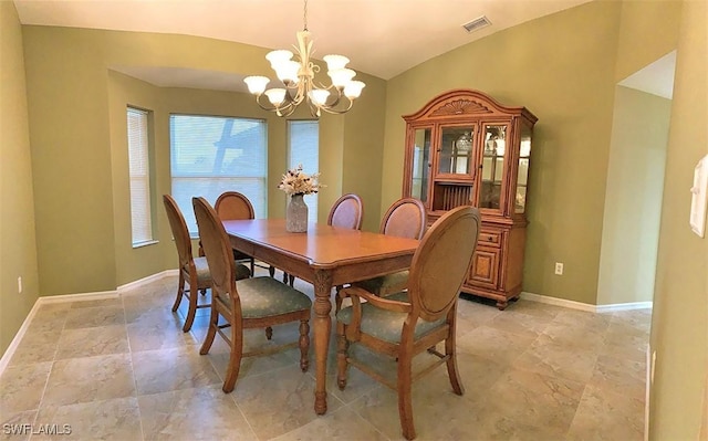 dining area featuring baseboards, visible vents, vaulted ceiling, and a notable chandelier