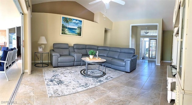 living area featuring high vaulted ceiling, ceiling fan, and baseboards