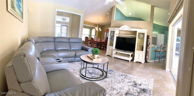 living area featuring vaulted ceiling and an inviting chandelier