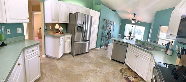 kitchen featuring white cabinetry, appliances with stainless steel finishes, and a sink