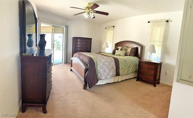 carpeted bedroom featuring a ceiling fan and access to exterior