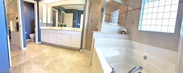 full bath with double vanity, toilet, a garden tub, a shower stall, and a sink