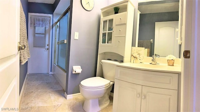 full bathroom featuring toilet, shower / bath combination with glass door, baseboards, and vanity