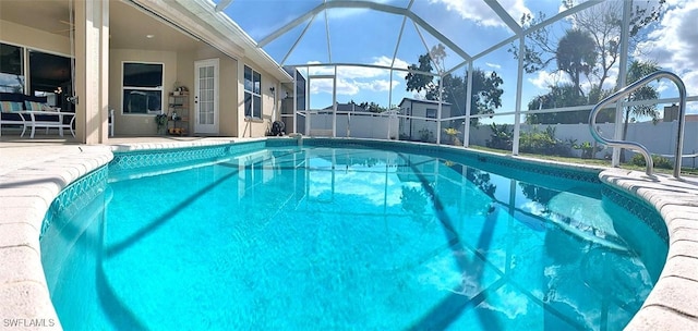 view of pool featuring a fenced in pool, a lanai, a patio, and fence