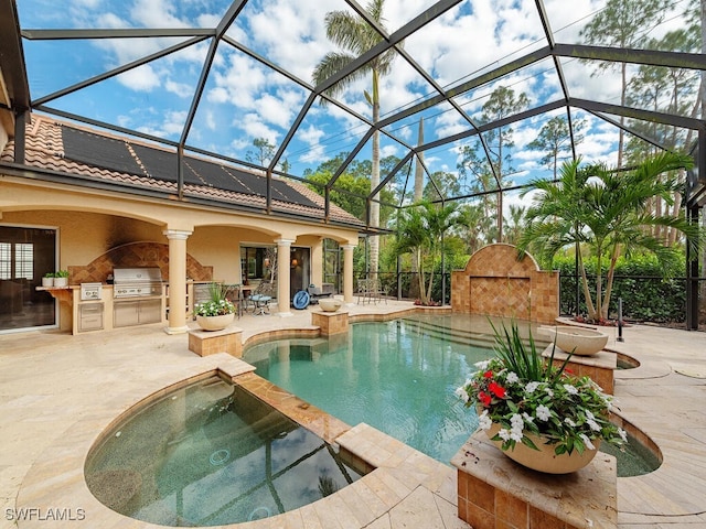 view of pool featuring a patio, area for grilling, a fireplace, and a pool with connected hot tub