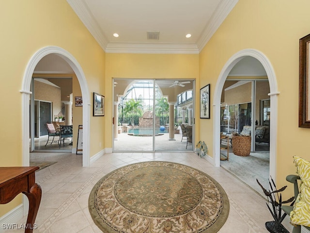 foyer with recessed lighting, a sunroom, visible vents, baseboards, and ornamental molding