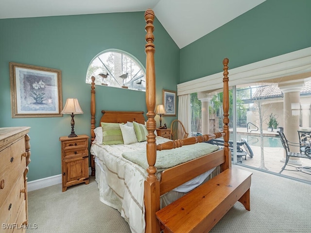 bedroom with carpet floors, access to outside, vaulted ceiling, and baseboards