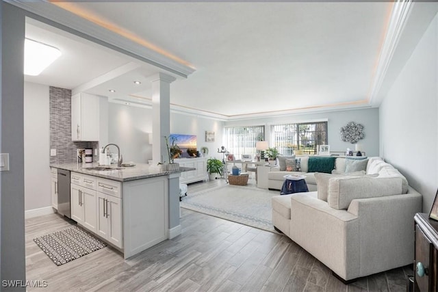 1085 Forest Lakes Dr Unit 8105, Naples, FL 34105 - living room with ornamental molding, baseboards, decorative columns, and light wood finished floors