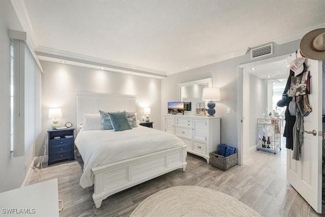 1085 Forest Lakes Dr Unit 8105, Naples, FL 34105 - bedroom with light wood-style floors, baseboards, visible vents, and crown molding
