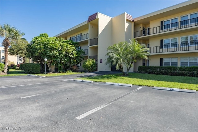 1085 Forest Lakes Dr Unit 8105, Naples, FL 34105 - view of building exterior with uncovered parking