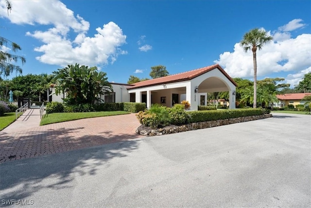 1085 Forest Lakes Dr Unit 8105, Naples, FL 34105 - view of front facade featuring decorative driveway and stucco siding