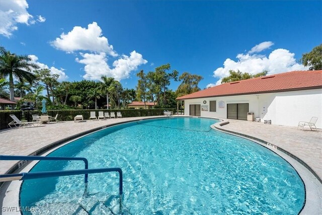 1085 Forest Lakes Dr Unit 8105, Naples, FL 34105 - pool featuring fence and a patio