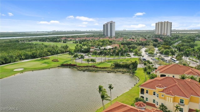 drone / aerial view featuring view of golf course and a water view