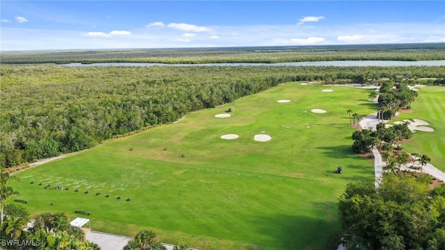 birds eye view of property with a water view and golf course view