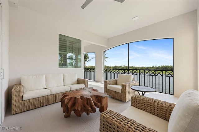 sunroom / solarium featuring ceiling fan