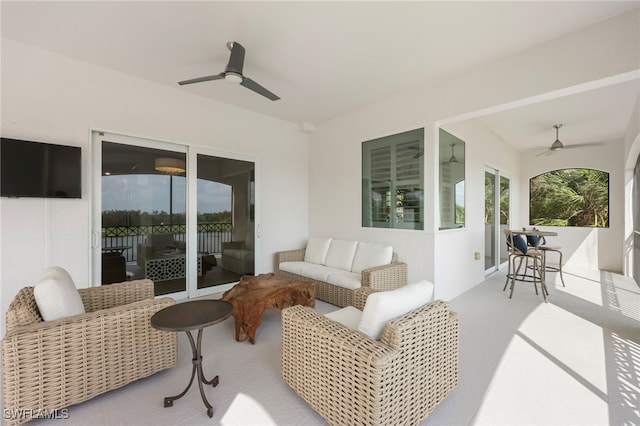 view of patio / terrace with ceiling fan and an outdoor hangout area