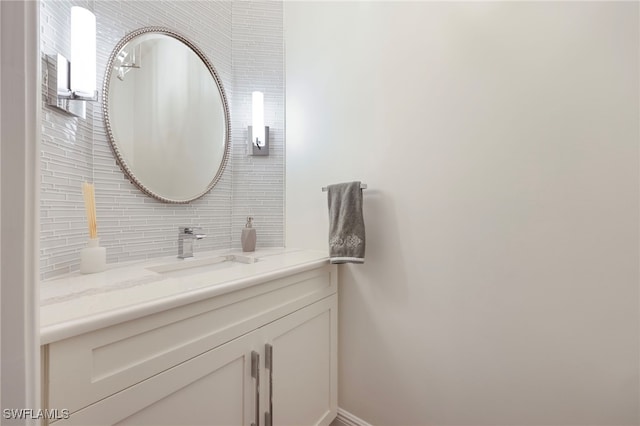 bathroom with backsplash and vanity