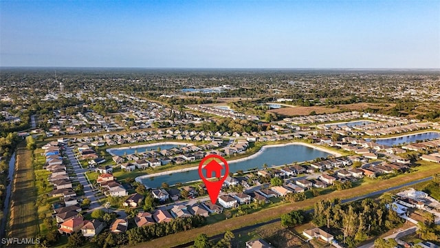 bird's eye view featuring a residential view and a water view