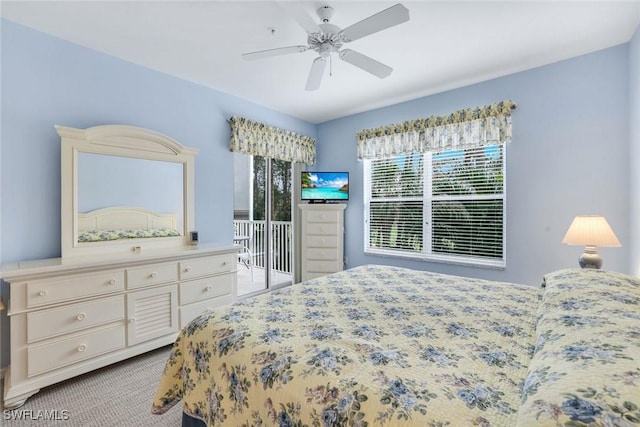 bedroom featuring access to exterior, light carpet, and ceiling fan