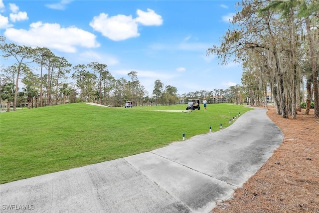 view of home's community featuring a lawn