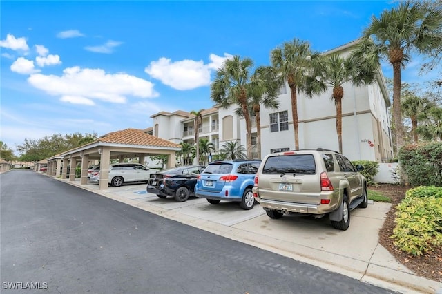 view of partially covered parking lot