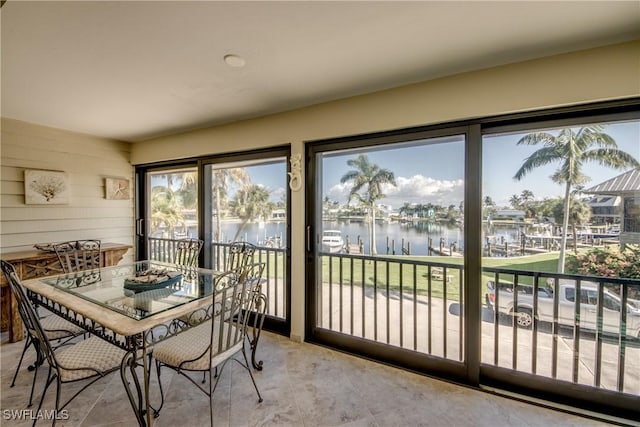 dining area featuring a water view