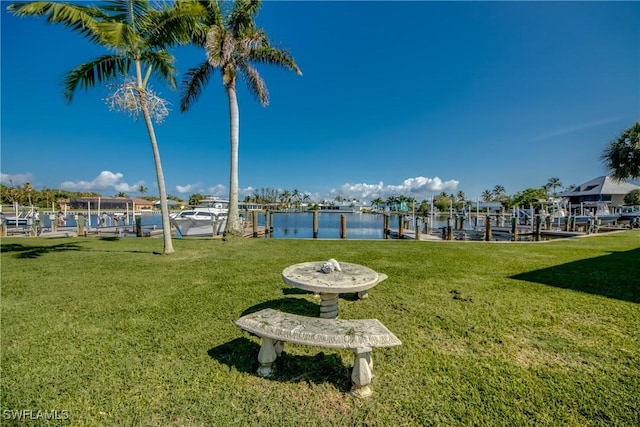 view of yard featuring a dock and boat lift