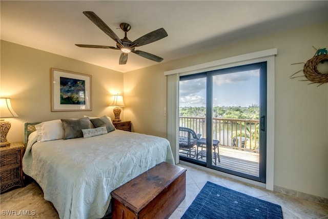 bedroom featuring baseboards, light tile patterned flooring, a ceiling fan, and access to exterior