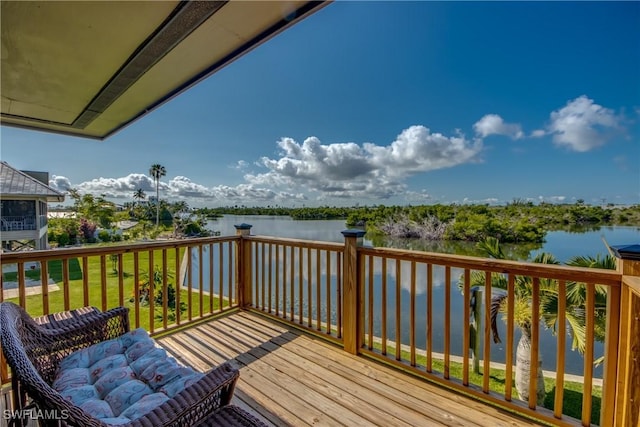 wooden deck featuring a water view